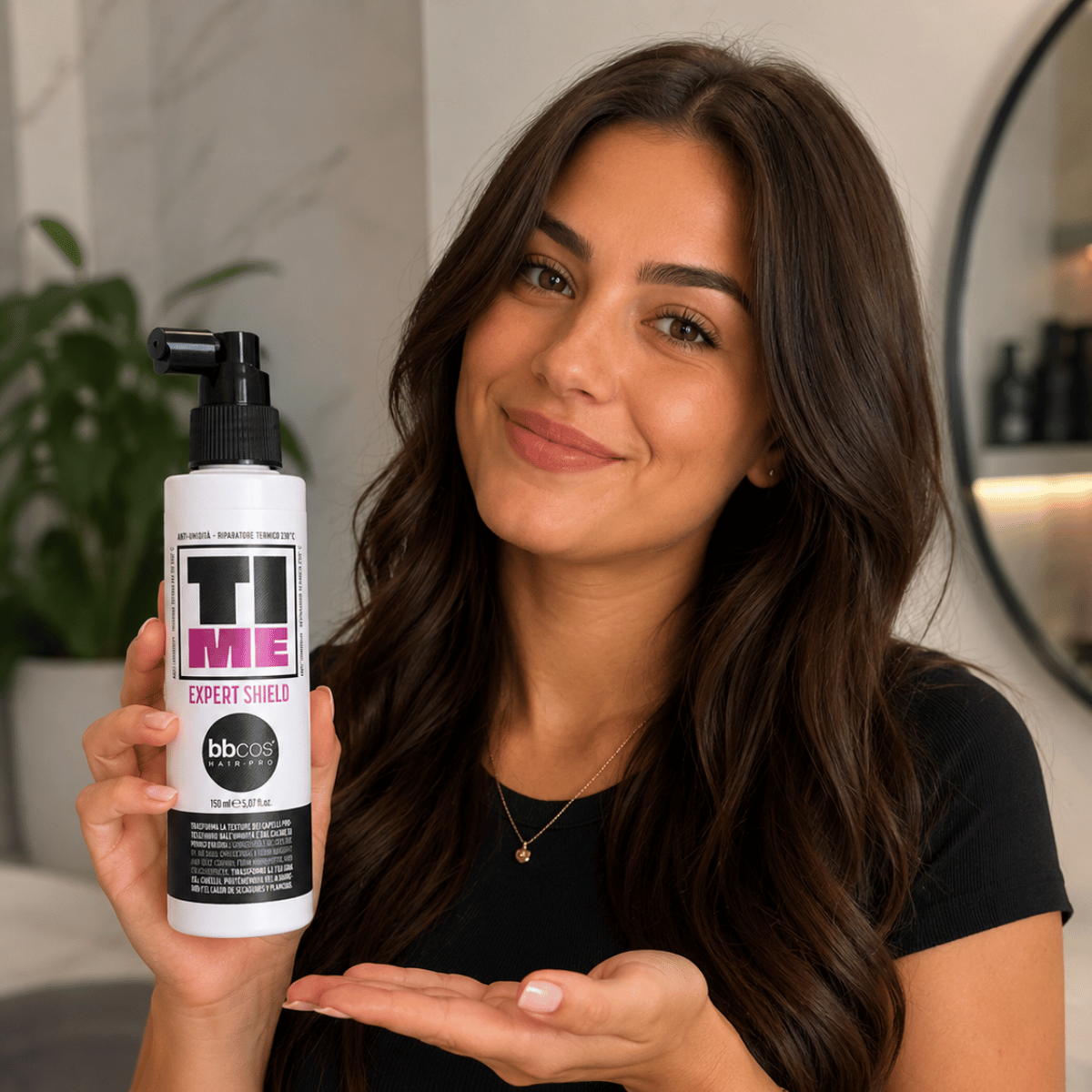 Woman holding a bottle of &